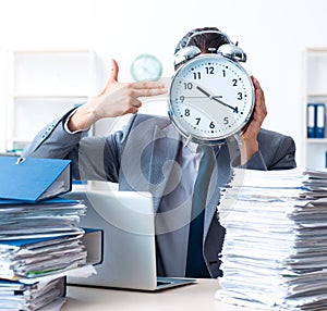 Businessman with heavy paperwork workload