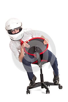 Businessman with helmet racing in a chair