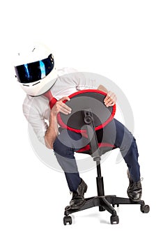 Businessman with helmet racing in a chair