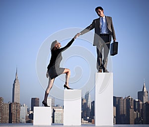 Businessman Helping Colleague Succeed Concept