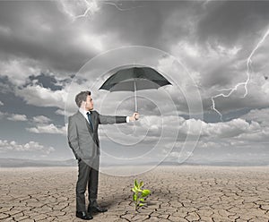 Businessman helps agriculture photo