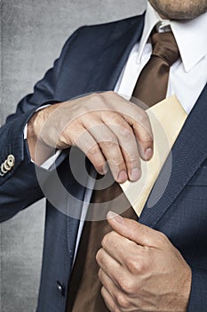 Businessman hiding bribes