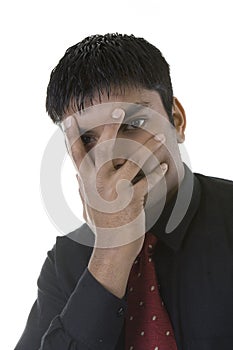 Businessman hiding face