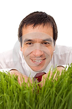 Businessman hiding in grass - isolated