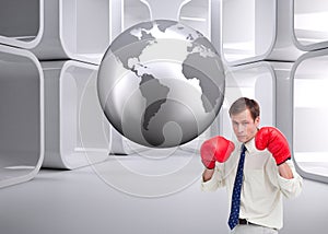 Businessman with his boxing gloves ready to fight