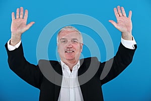 Businessman with his hands up