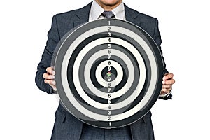 Businessman hold dartboard with arrow hitting the target