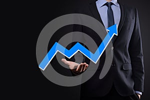 Businessman hold drawing on screen growing graph, arrow of positive growth icon.pointing at creative business chart with upward