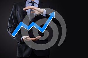 Businessman hold drawing on screen growing graph, arrow of positive growth icon.pointing at creative business chart with upward