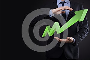 Businessman hold drawing on screen growing graph  arrow of positive growth icon.pointing at creative business chart with upward