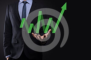 Businessman hold drawing on screen growing graph, arrow of positive growth icon.pointing at creative business chart with upward