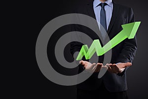 Businessman hold drawing on screen growing graph, arrow of positive growth icon.pointing at creative business chart with upward