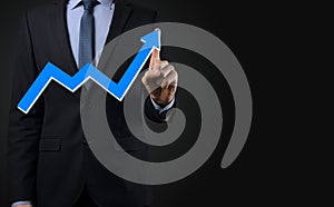 Businessman hold drawing on screen growing graph, arrow of positive growth icon.pointing at creative business chart with upward