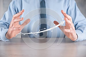 Businessman hold drawing on screen growing graph, arrow of positive growth icon.pointing at creative business chart with upward