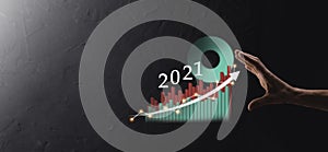 Businessman hold drawing on screen growing graph, arrow of positive growth icon.pointing at creative business chart with upward