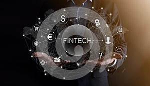 Businessman hold Fintech -financial technology concept.Business investment banking payment. Cryptocurrency investment and digital