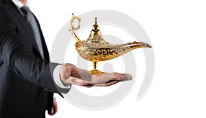 Businessman hold a genie lamp of aladdin. concept of desire and make a wish come true