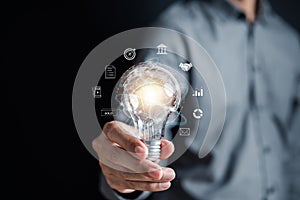 Businessman hold lightbulb planning development leadership and customer target group with Business global internet connection