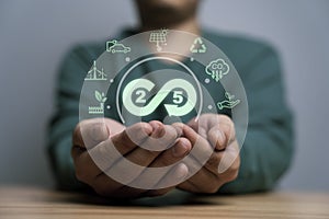 Businessman holding 2050 infinity symbol with environment icon include green factory carbon reduction footprint credit and