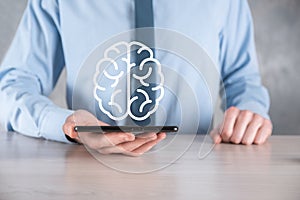 Businessman holding abstract brain and icon tools, device, customer network connection communication on virtual , innovative