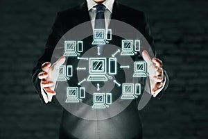 Businessman holding abstract computer network
