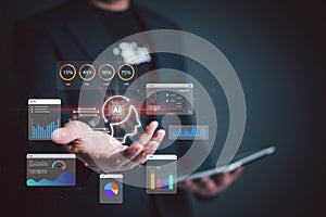Businessman holding AI technology icons with data analytics, machine learning charts, and virtual interface. Concept of artificial