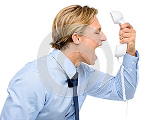 Businessman holding analogue phone isolated on white background photo