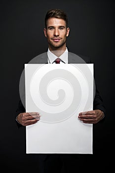 Businessman holding banner with copy space