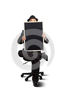 Businessman holding a blackboard.