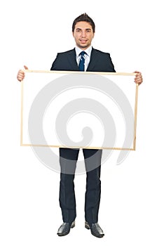 Businessman holding blank banner