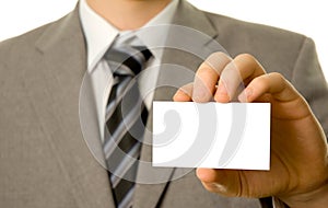 Businessman holding blank business card