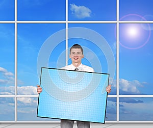 Businessman holding blank plasma panel