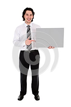 Businessman holding blank poster