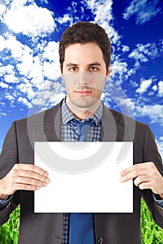 Businessman holding a blank sign.