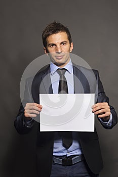 Businessman Holding a Blank Sign