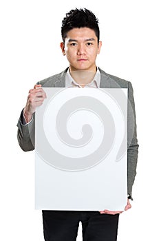 Businessman holding blank sign