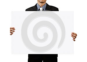 Businessman holding blank sign on white