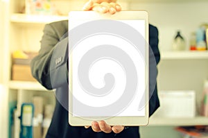 Businessman holding a blank white touch screen tablet. Used to put text or information to advertise news or sell products online.