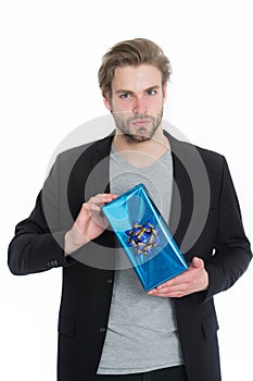 Businessman holding blue gift box