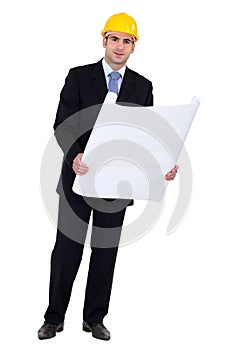 Businessman holding a blueprint