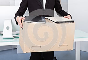 Businessman holding box