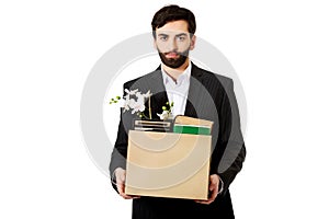 Businessman holding box with personal belongings.