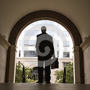 Businessman holding briefcase. photo