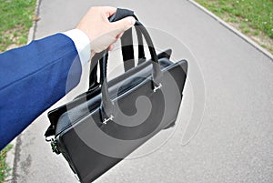 Businessman holding a briefcase.
