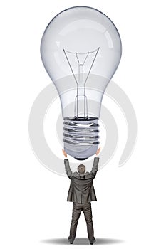 Businessman holding bulb