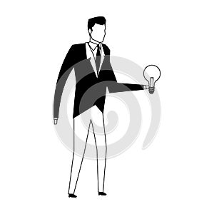 Businessman holding bulb light in black and white