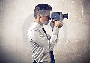 Businessman holding a camera