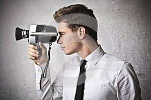 Businessman holding a camera