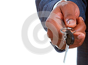 Businessman holding car keys in his hand