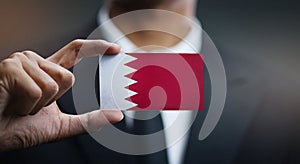 Businessman Holding Card of Bahrain Flag